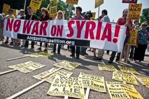 People demonstrate against a US-led strike on Syria in front of the White House in Washington on August 31, 2013. The US Congress will begin to debate a possible military strike against Syria during the week beginning September 9, the Republican leadership of the House of Representatives said after US President Barack Obama said he would seek the authorization of Congress for any such action.   AFP PHOTO/Nicholas KAMM        (Photo credit should read NICHOLAS KAMM/AFP/Getty Images)